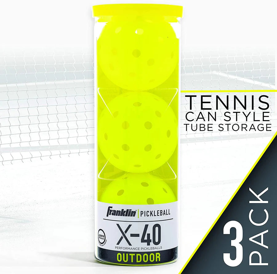 A clear tube contains three Franklin X-40 Outdoor Pickleball Balls in neon yellow. Featuring machine-drilled holes for precision play, they're USAPA approved and labeled "3 Pack" on a net background.
