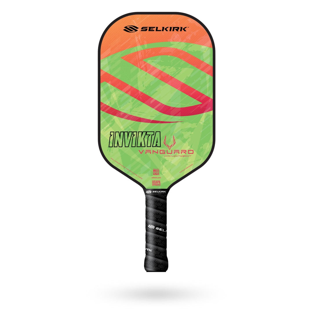 Image of a Selkirk Vanguard Invikta Pickleball Paddle with a green and orange design and the text "INVICTA VANGUARD" on the face. The handle is wrapped in black grip tape. This premium paddle comes with a Limited Lifetime Warranty from Selkirk.