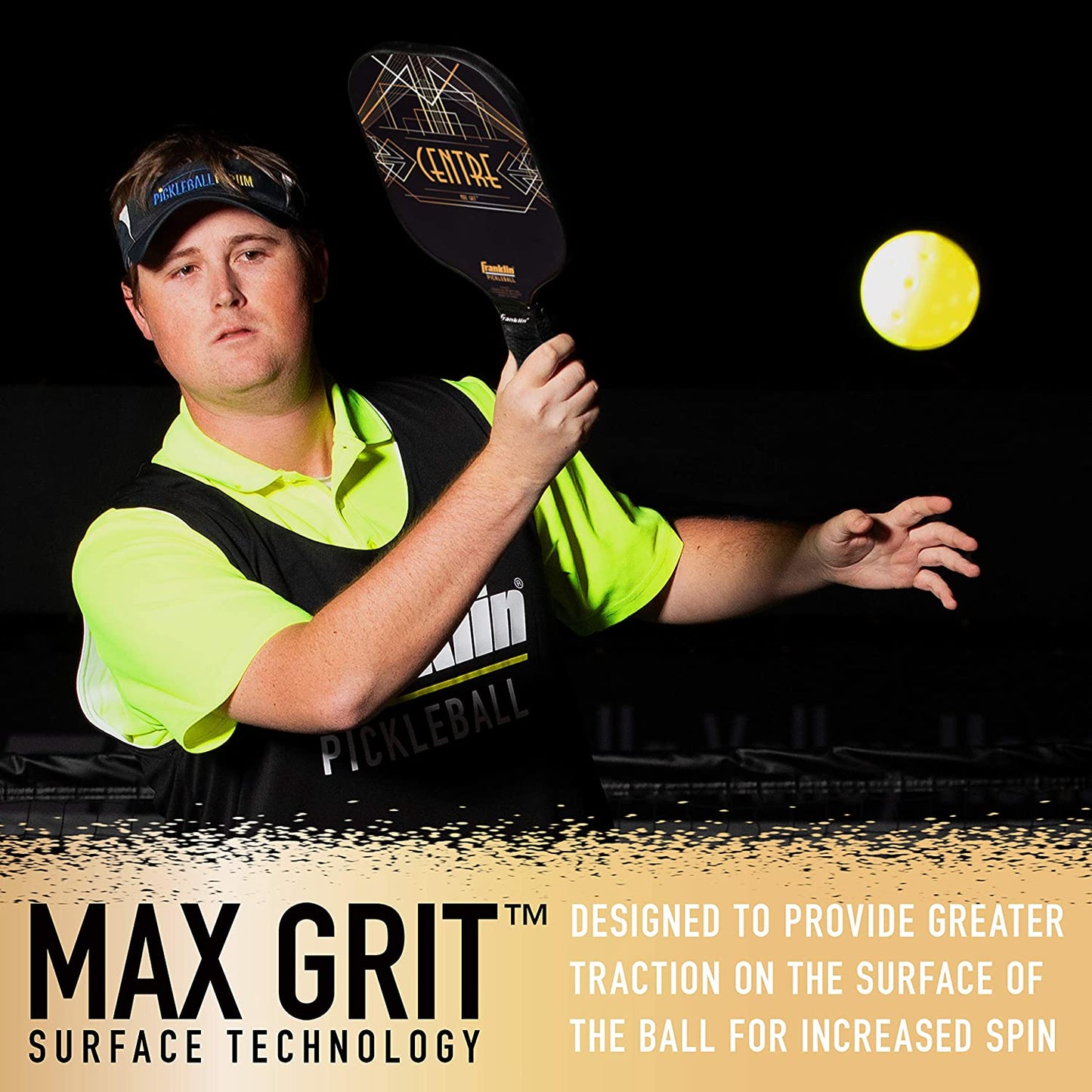 A man in a black and green shirt playing pickleball at night, swinging a Pickleballist Franklin Aspen Kern Centre Carbon Fiber Pickleball Paddle at a glowing yellow ball, with text about "MaxGrit surface material".