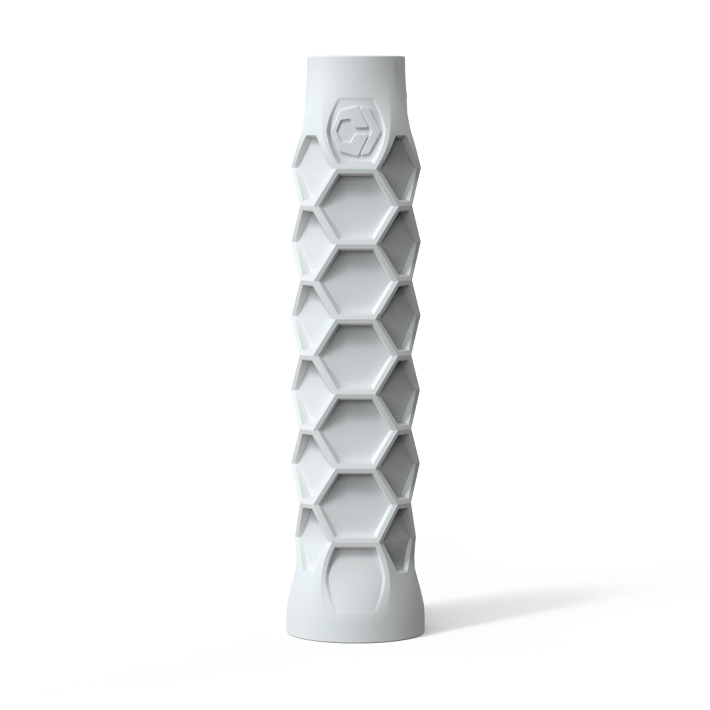 The Hesacore Elongated (White) Pickleball Grip, by Hesacore, features a hexagonal pattern and stands upright against a white background.
