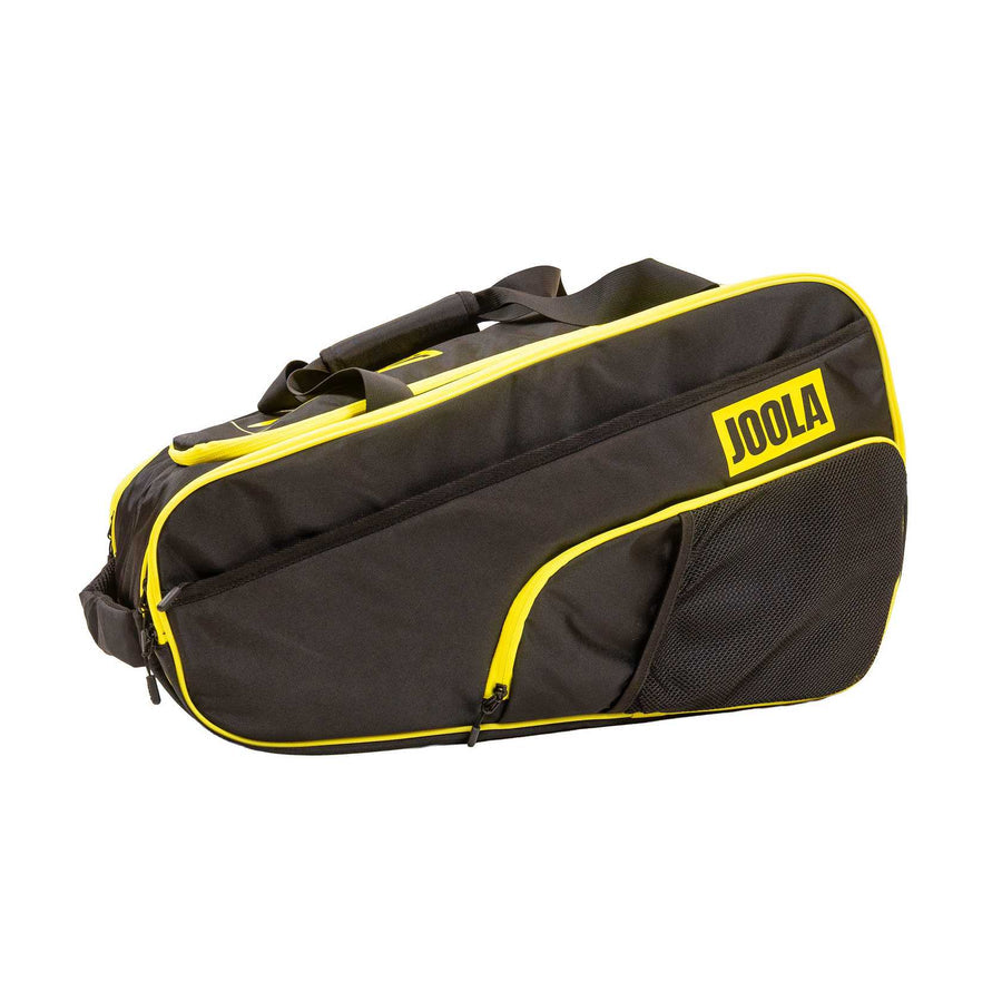 The Pickleballist 2026 Tour Elite Pro Pickleball Bag, in black and yellow with zippered compartments, side mesh pocket, and carrying handles—ideal for tournament players—is displayed against a white background.