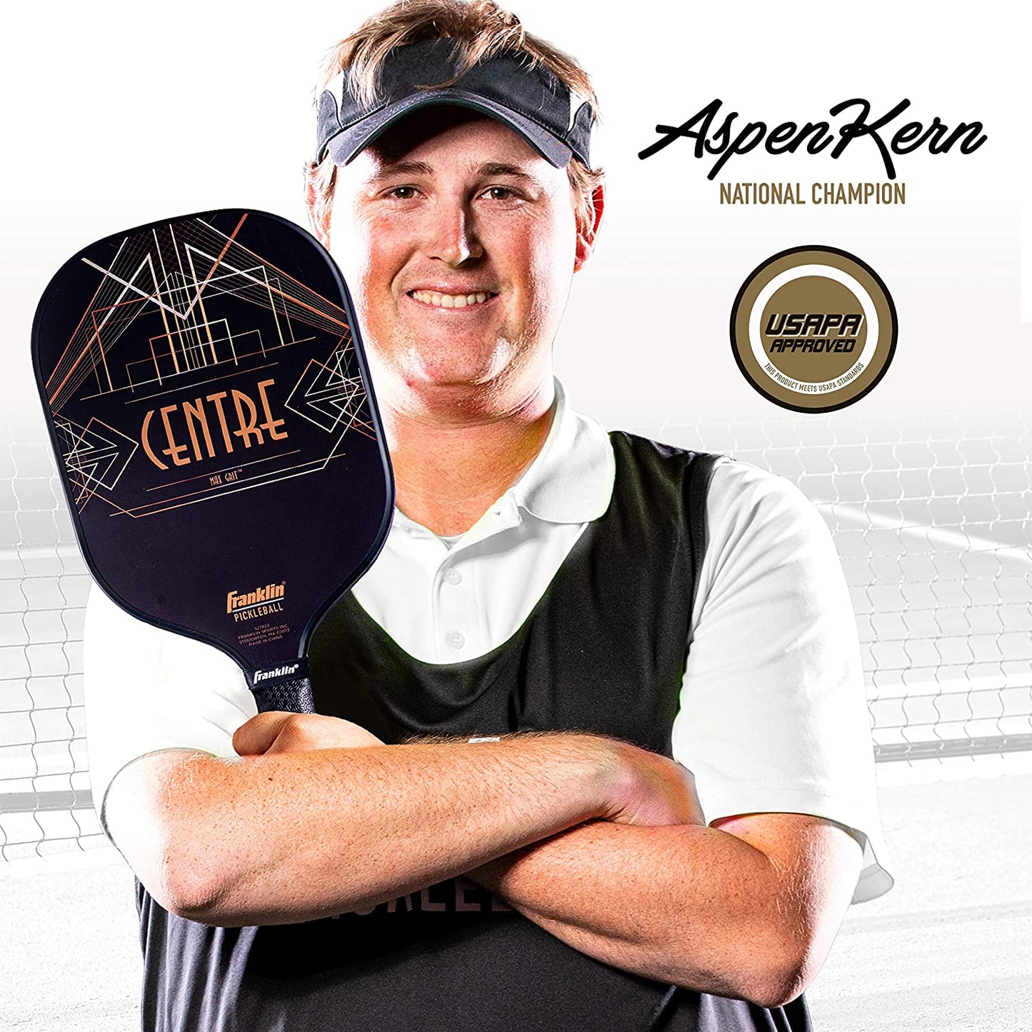 A smiling man holding a Franklin Aspen Kern Centre Carbon Fiber Pickleball Paddle with MaxGrit surface material, wearing a cap and sportswear, with text "aspenkerr national champion" and a logo marked "USAPA
