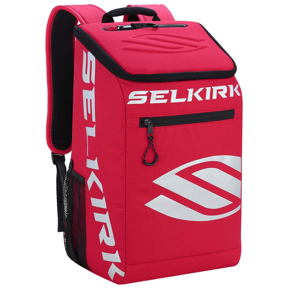 A red Selkirk Team Backpack (2022) Pickleball Bag with black shoulder straps, large front pocket with a zipper, and a white Selkirk logo on the front and sides.