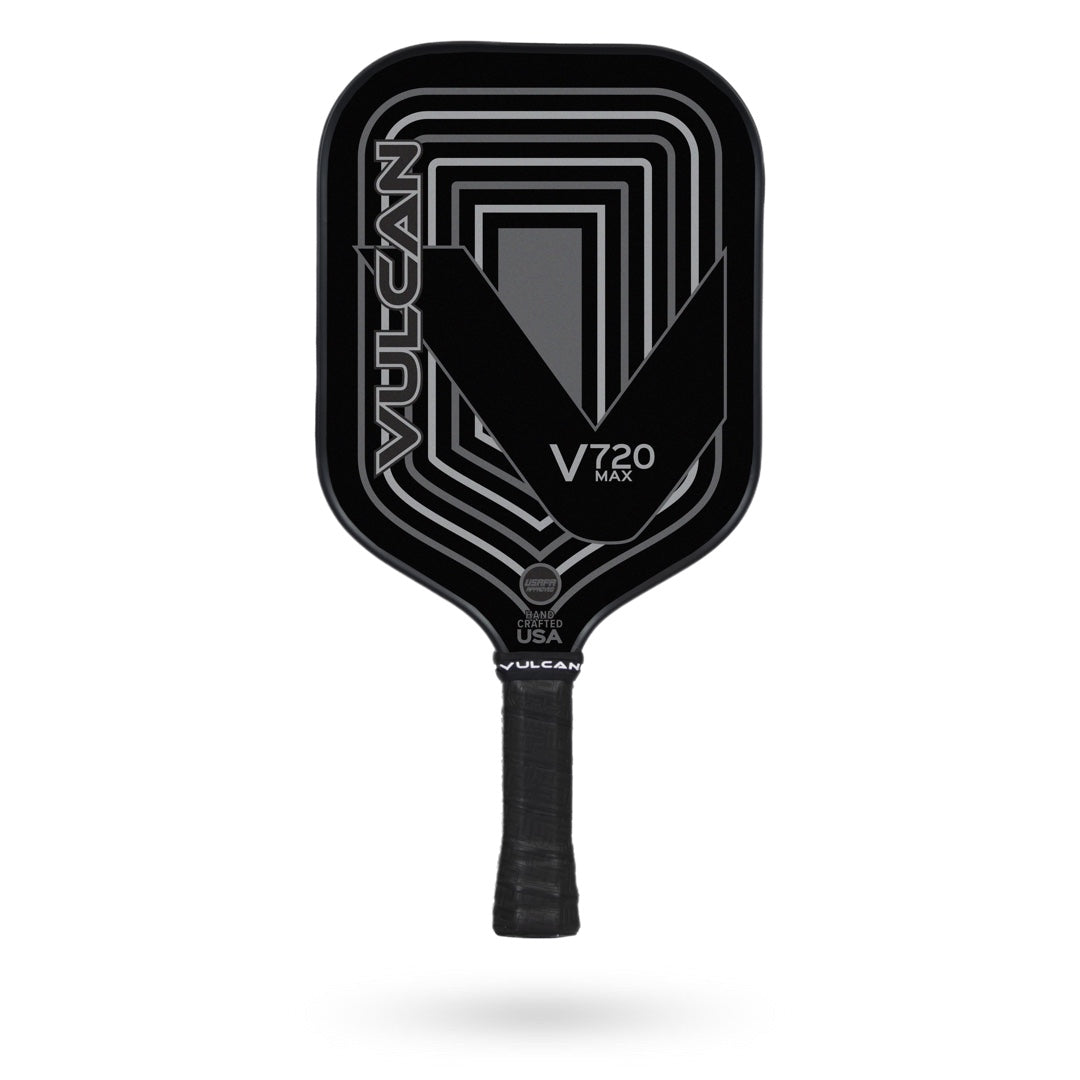 A black Vulcan V720 MAX Pickleball Paddle with geometric patterns on the face and the text "Vulcan" and "V720 Max." Handcrafted in the USA for premium performance.