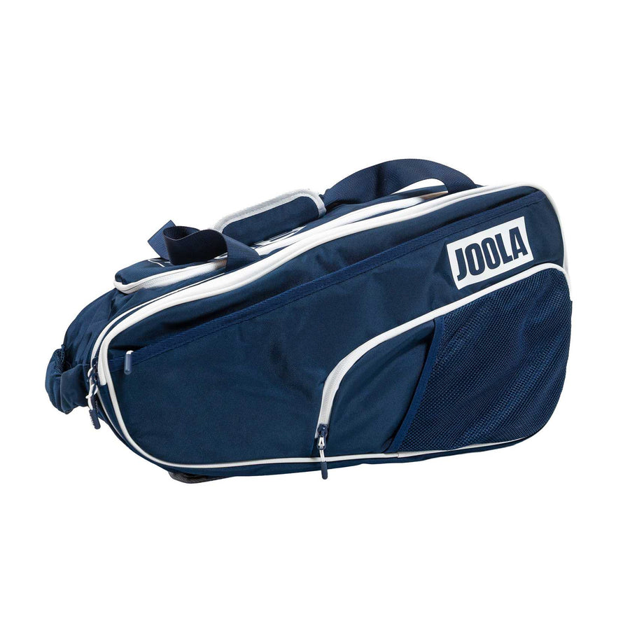 The Pickleballist JOOLA 2026 Tour Elite Pickleball Bag is navy blue with white trim, zippered compartments, a mesh pocket, and a convenient shoulder strap.