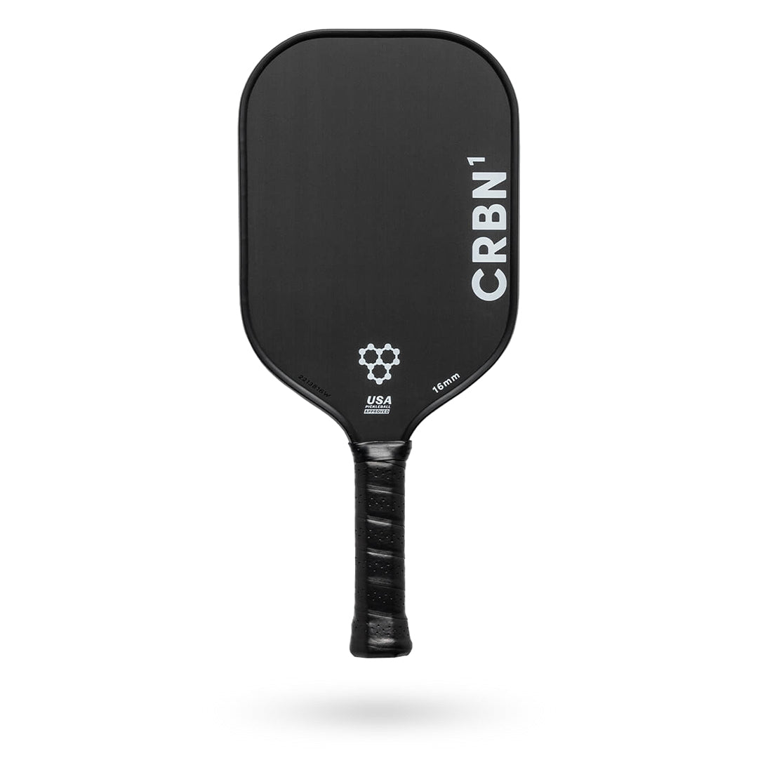 A black Pickleballist CRBN 1 - 13mm pickleball paddle with a white logo, positioned vertically on a white background.