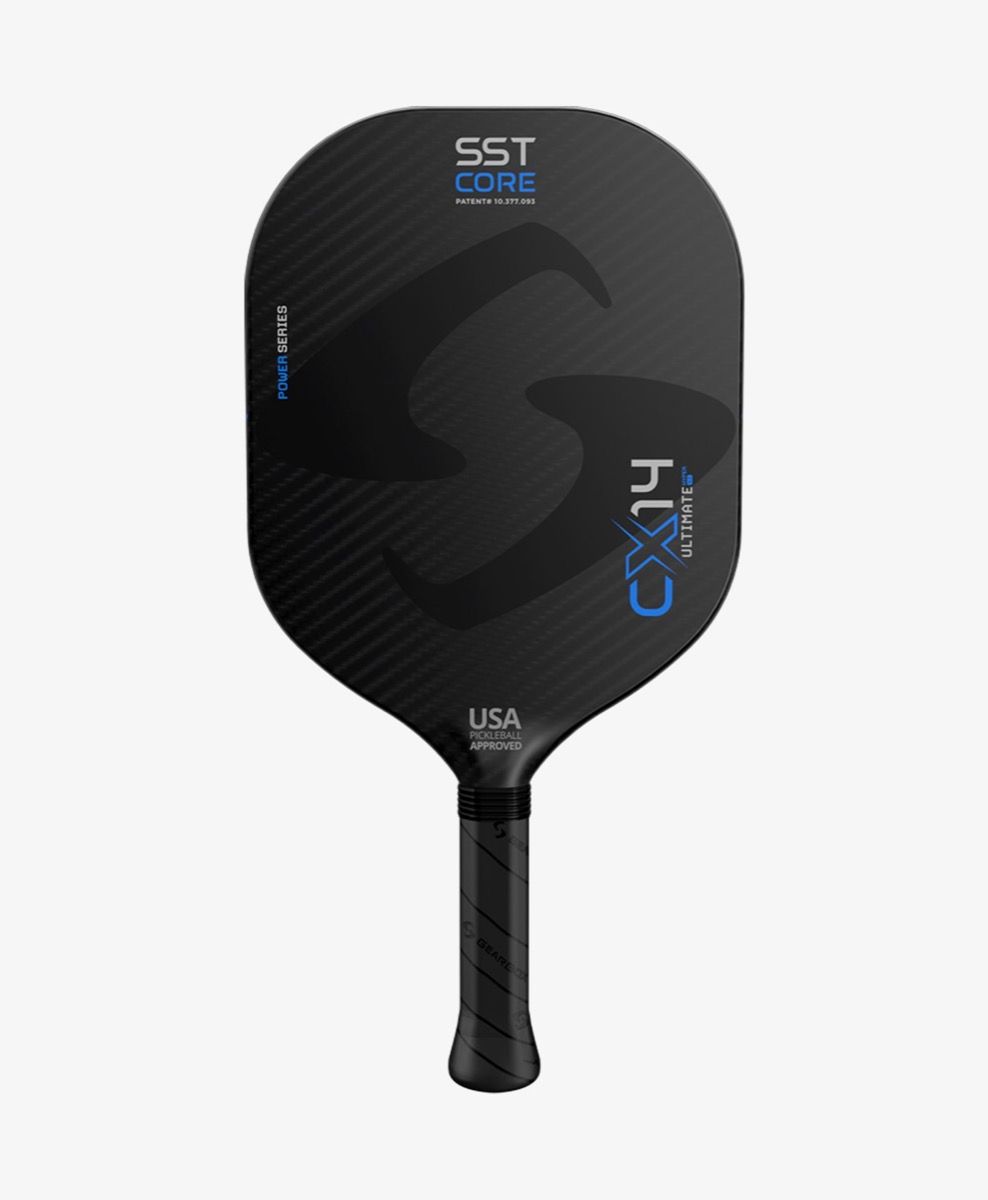 A black pickleball paddle with the label "SST Core" and model number "Gearbox CX14H Ultimate Power Pickleball Paddle" in blue text, featuring a textured grip and branded with "Gearbox USA Approved.
