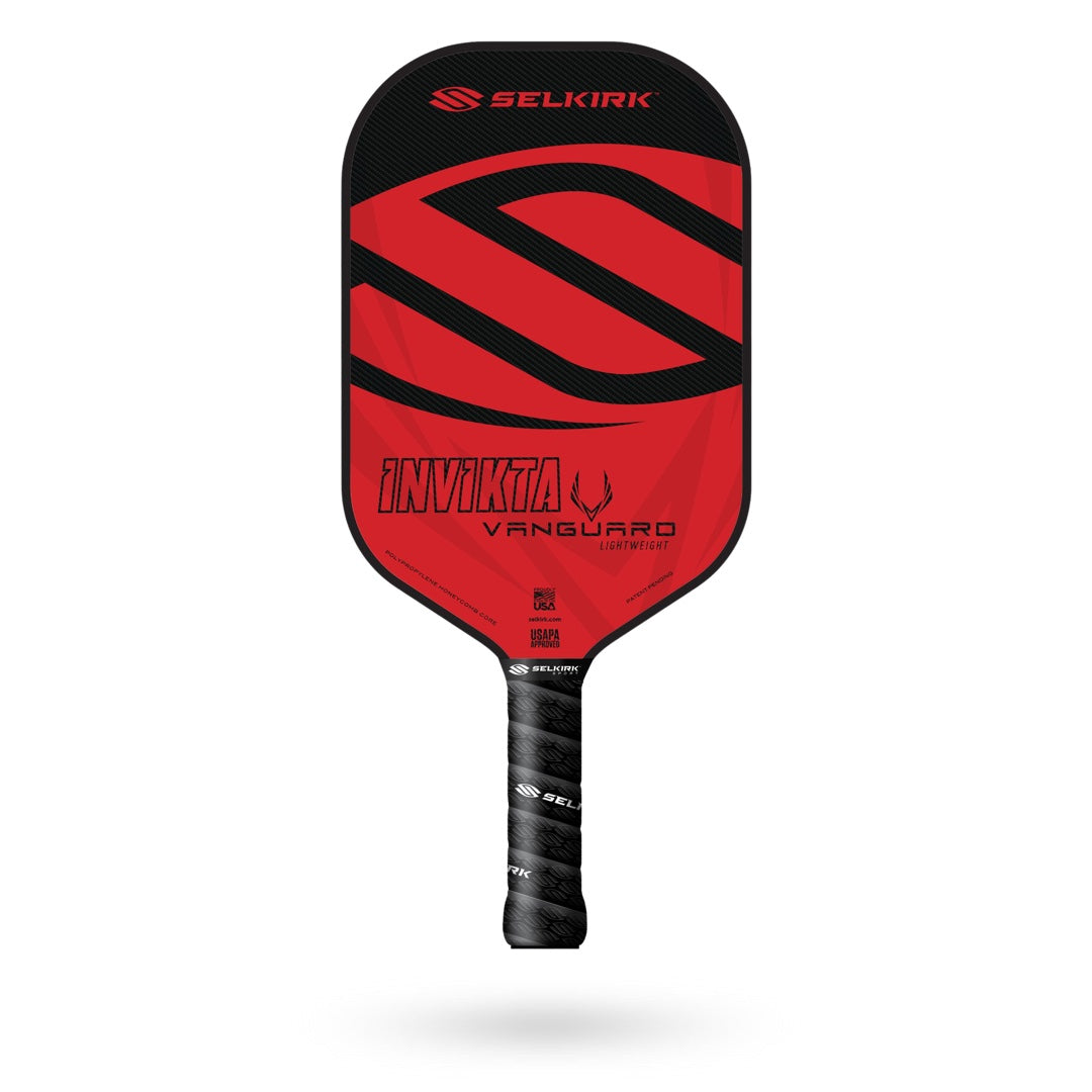 Image of a red and black Selkirk pickleball paddle with branding text that reads "Selkirk Vanguard Invikta Pickleball Paddle" on the face and "Selkirk" along the handle. Crafted by Selkirk, this high-performance paddle comes with a Limited Lifetime Warranty.