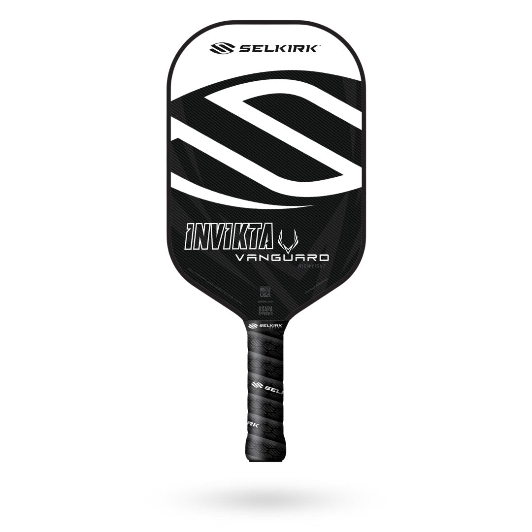 The Selkirk Vanguard Invikta Pickleball Paddle featuring a sleek black and white design, with the text “Invikta” and “Vanguard” on the face. This high-quality paddle also comes with a Limited Lifetime Warranty for peace of mind.