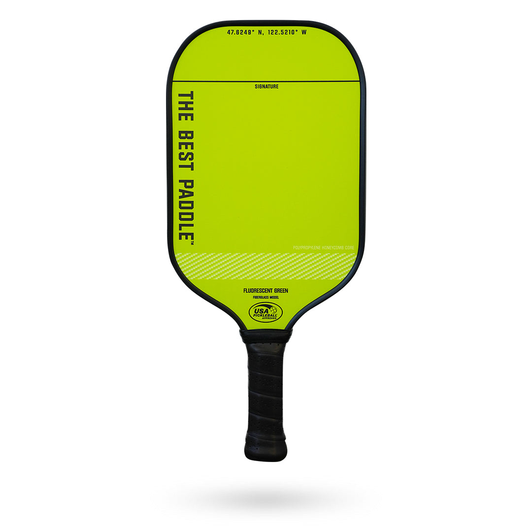 A neon yellow Pickleballist "The Best Paddle" fiberglass pickleball paddle with black handle and coordinates, against a white background.
