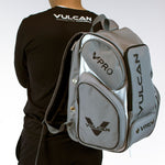A person wearing a black shirt with a gray and white Pickleballist Vulcan VPro Pickleball Bag. The bag features multiple compartments and the Vulcan logo.