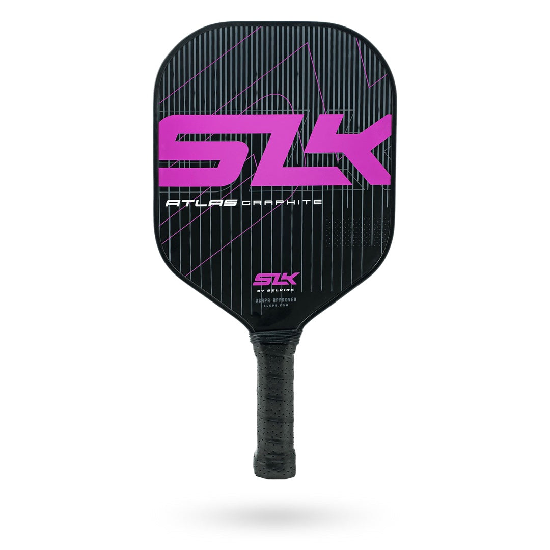 Black and pink Pickleballist Selkirk SLK Atlas Pickleball Paddle with a polymer powercore and striped design on the hitting surface, isolated on a white background.