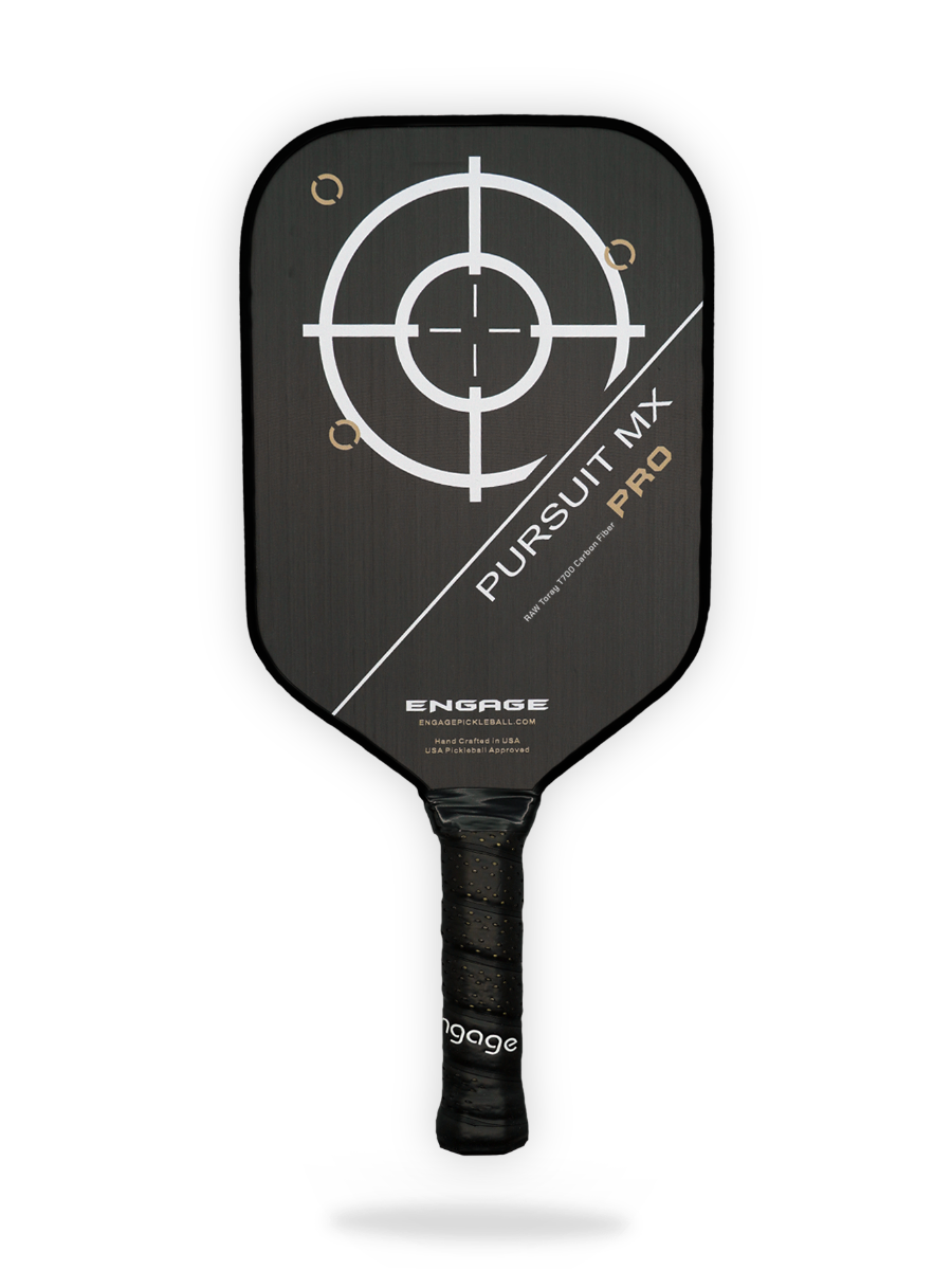 A black Engage Engage Pursuit Pro MX Pickleball Paddle with a large white target design on the face and the text "Pursuit MX Pro" and "Engage" written on it.