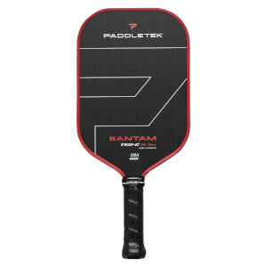 A Paddletek Bantam TKO-C 14.3mm Carbon Fiber pickleball paddle with a black face, red edge, and black grip handle, featuring branding and decorative lines on the paddle face.