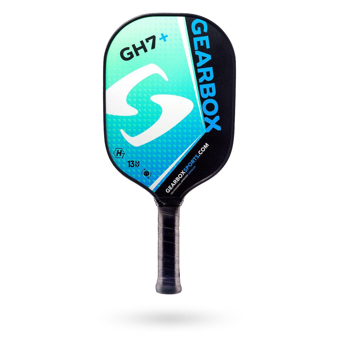 Image of a Gearbox GH7+ Pickleball Paddle with black and teal colors, featuring the Gearbox logo and website. This Gearbox GH7+ Pickleball Paddle showcases superior construction, ensuring top-notch performance on the court.