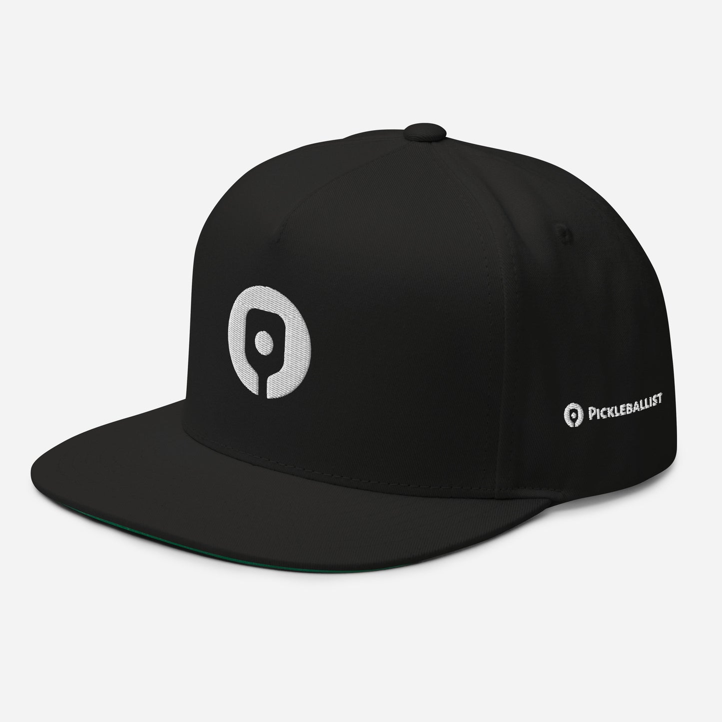 The Pickleballist Signature Logo Flat Brim Pickleball Hat by Pickleballist is a sleek black cap with a high-profile fit, showcasing a white pickleball paddle and ball logo on the front, "PICKLEBALLIST" text on the side, and an adjustable snapback closure for convenience.