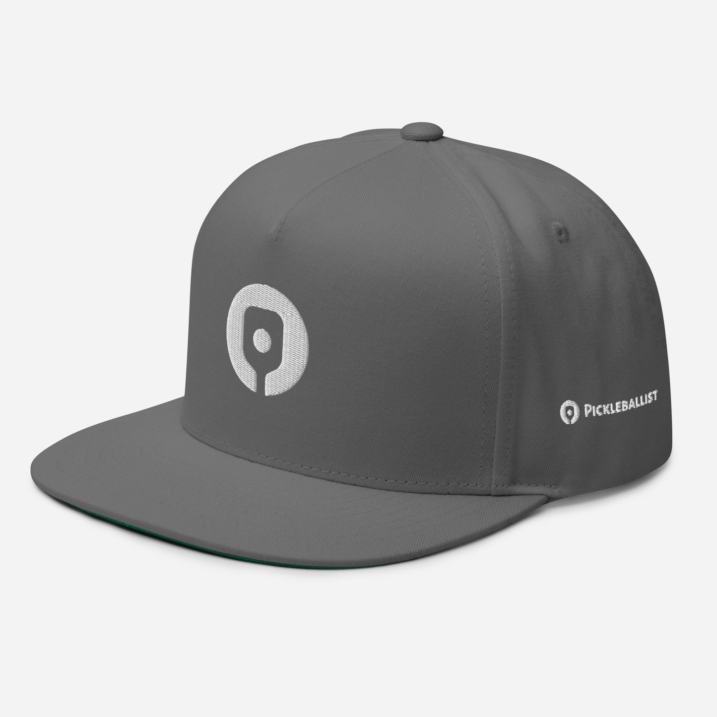 The Pickleballist Signature Logo Flat Brim Pickleball Hat from Pickleballist is a gray flat-bill cap with a high-profile fit featuring a white logo on the front, the word "PICKLEBALLIST" on the side, and a convenient snapback closure.
