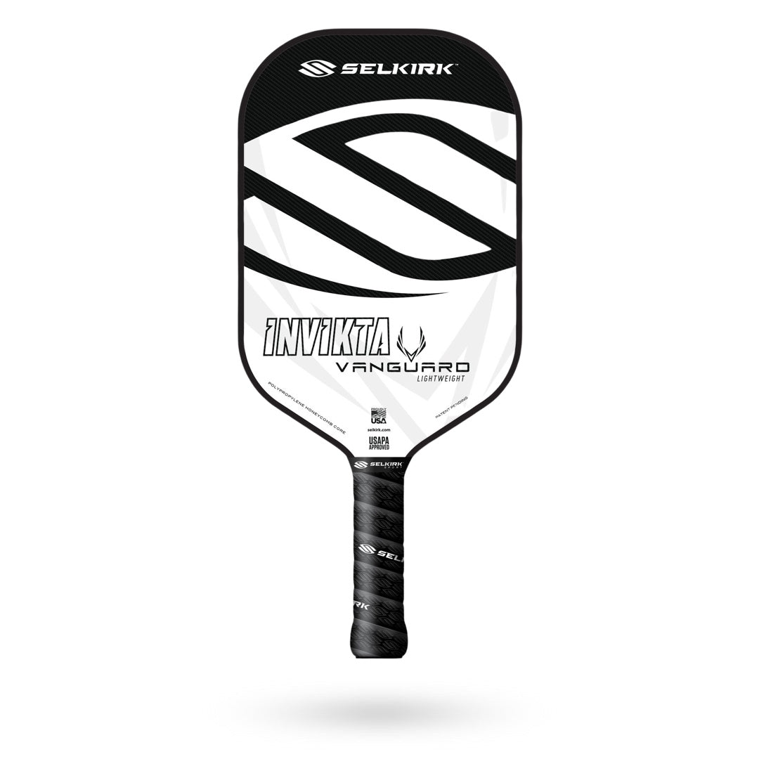 A Selkirk Vanguard Invikta Pickleball Paddle with a black and white design, featuring the Selkirk logo and product name. It also comes with a limited lifetime warranty for added peace of mind.