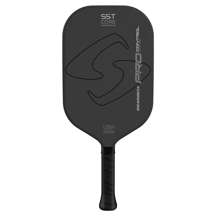 A black Gearbox Pro Control Elongated Pickleball Paddle, featuring "SST Core", "USA", and "Gearbox Pro Control" text, showcases the Solid Span Technology for enhanced performance.