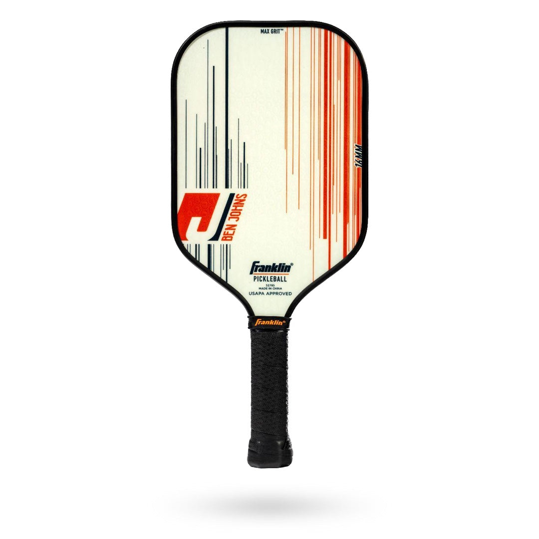 Image of a Franklin Ben Johns Signature Pickleball Paddle featuring a white face, black edge, and black handle. The paddle showcases red, black, and orange linear designs with text reading "Franklin" and "Ben Johns." It incorporates MaxGrit technology and has a durable polypropylene core.