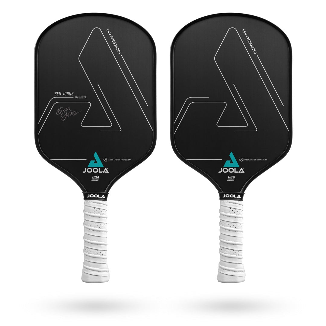 Two black JOOLA Ben Johns Hyperion CFS 16 Pickleball Paddles with white grips are displayed side by side. One paddle features a signature with the name "Ben Johns." The advanced design includes a CARBON FRICTION SURFACE for optimal spin and an AERO-CURVE for improved aerodynamics.