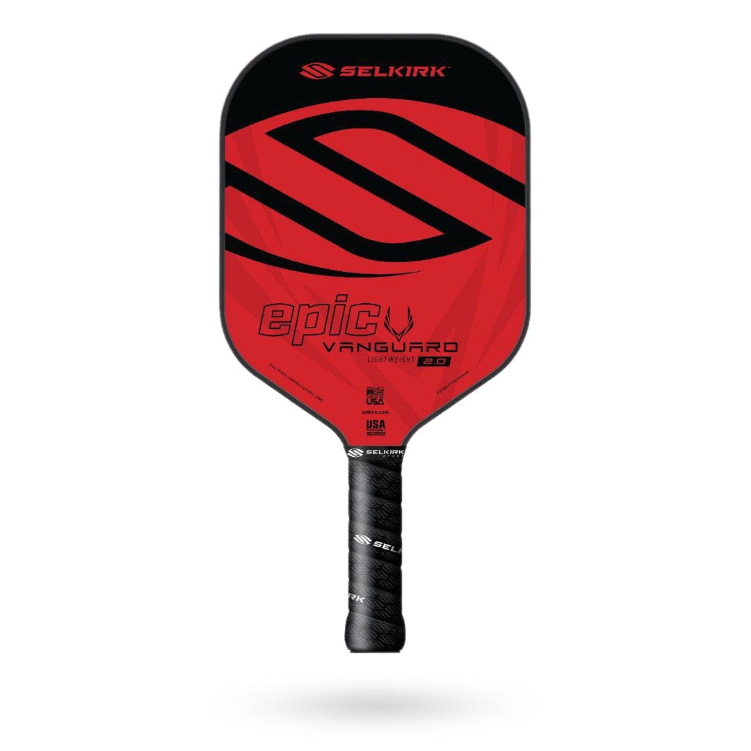 A red and black Selkirk Vanguard Epic Pickleball Paddle labeled "epic Vanguard." The paddle features a stylized 'S' logo, various text details, and a QuadCarbon Face for enhanced durability.