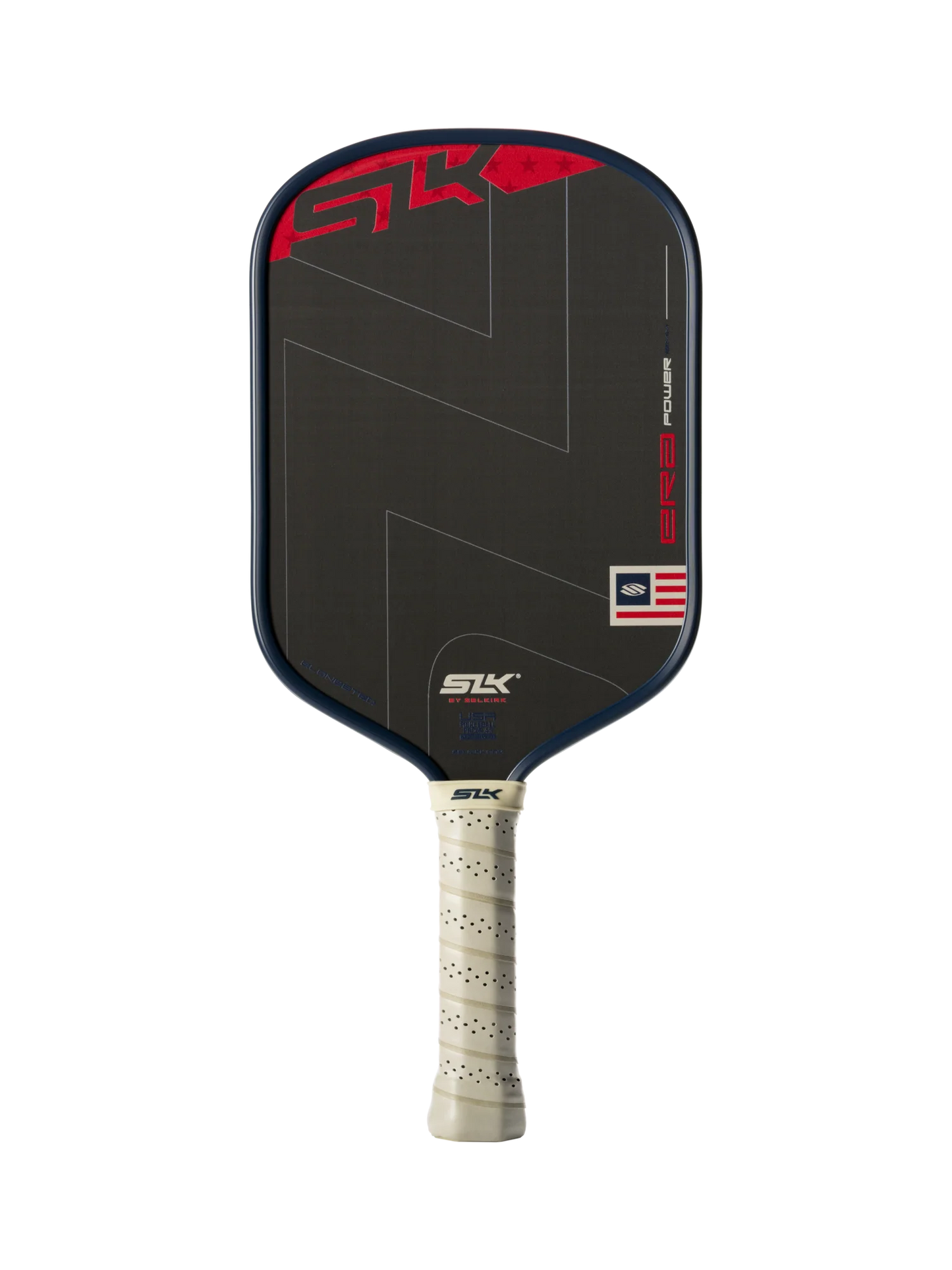The Selkirk SLK ERA Power Elongated Carbon Fiber Pickleball Paddle by Selkirk features a sleek black elongated design, a beige perforated grip, red and white graphic accents, and a small American flag detail on the lower right corner of the paddle face.