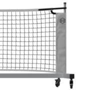 Portable indoor pickleball net with a net attached to a metal frame on wheels, designed for easy mobility and setup. Manufactured by Dominator, this product is called the Dominator Standard Portable Pickleball Net.