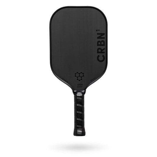 A black Pickleballist CRBN 1 - 13mm pickleball paddle with a textured surface and logo, viewed straight on against a white background.