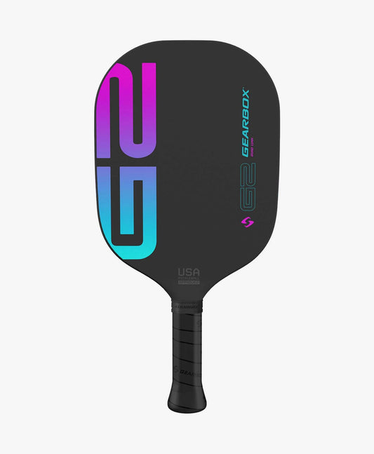 The Gearbox G2 Quad 11mm Edgeless Pickleball Paddle features a black face with a multicolored "G2" design and a textured handle for grip.