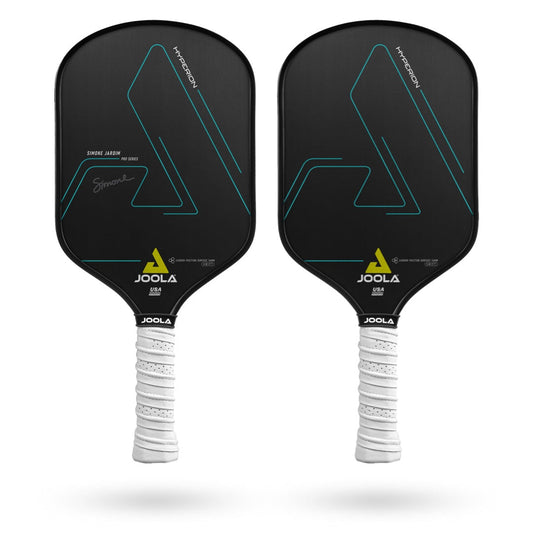 Two JOOLA Simone Jardim Hyperion CFS 14 Swift Pickleball Paddles with black faces and white handles, each featuring a minimalist geometric design and a signature on the left paddle. The paddles boast a CARBON FRICTION SURFACE for enhanced spin and control, paired with a REACTIVE HONEYCOMB POLYMER CORE for ultimate responsiveness.