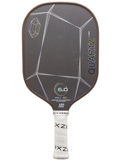 A detailed image of the Six Zero Quartz (15mm) Pickleball Paddle featuring a black face with a geometric design and a white handle, crafted by the brand Six Zero.