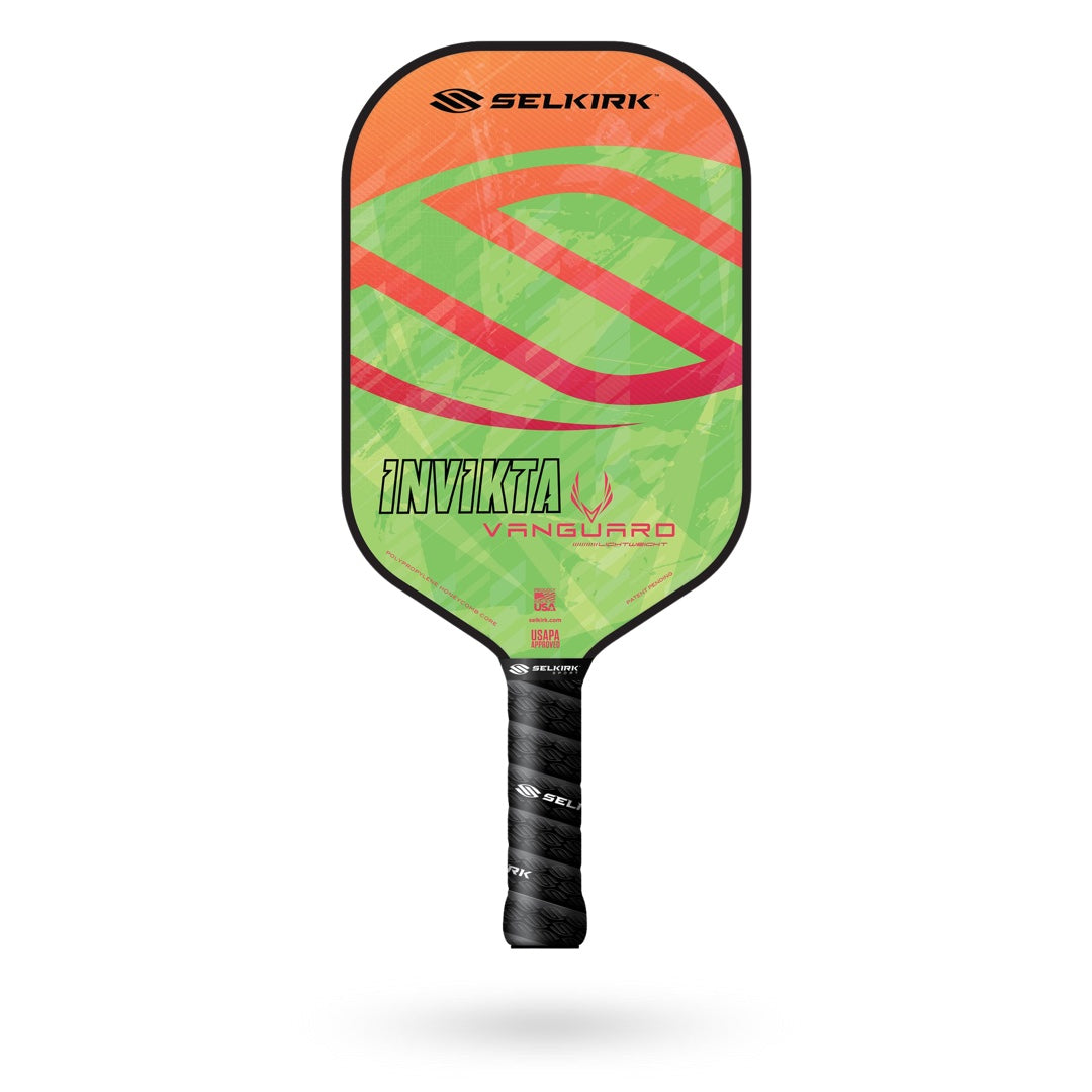 A Selkirk Vanguard Invikta Pickleball Paddle with an orange and green design.