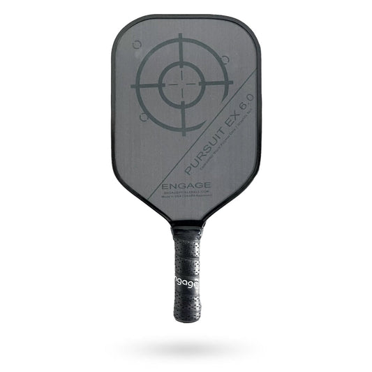 An Engage Pursuit EX 6.0 Pickleball Paddle with an arrow on it.