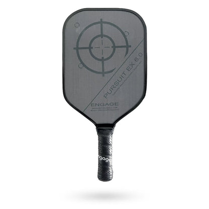 A black Engage Pursuit EX 6.0 Pickleball Paddle with a grip and a circular target design on the face. The paddle is labeled "Pursuit EX 6.0" and "Engage".