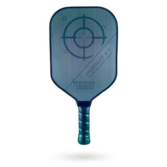 A gray Engage Pursuit EX Pickleball Paddle with a black target design and the text "Pursuit EX" on the face, and a black handle with a textured grip.