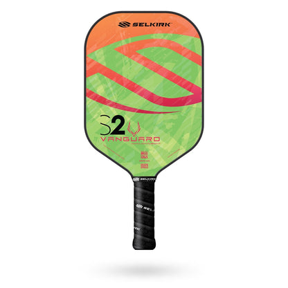 A Pickleballist Selkirk Vanguard S2 pickleball paddle used for pickleball, featuring a green and orange design with the vanguard S2 logo.