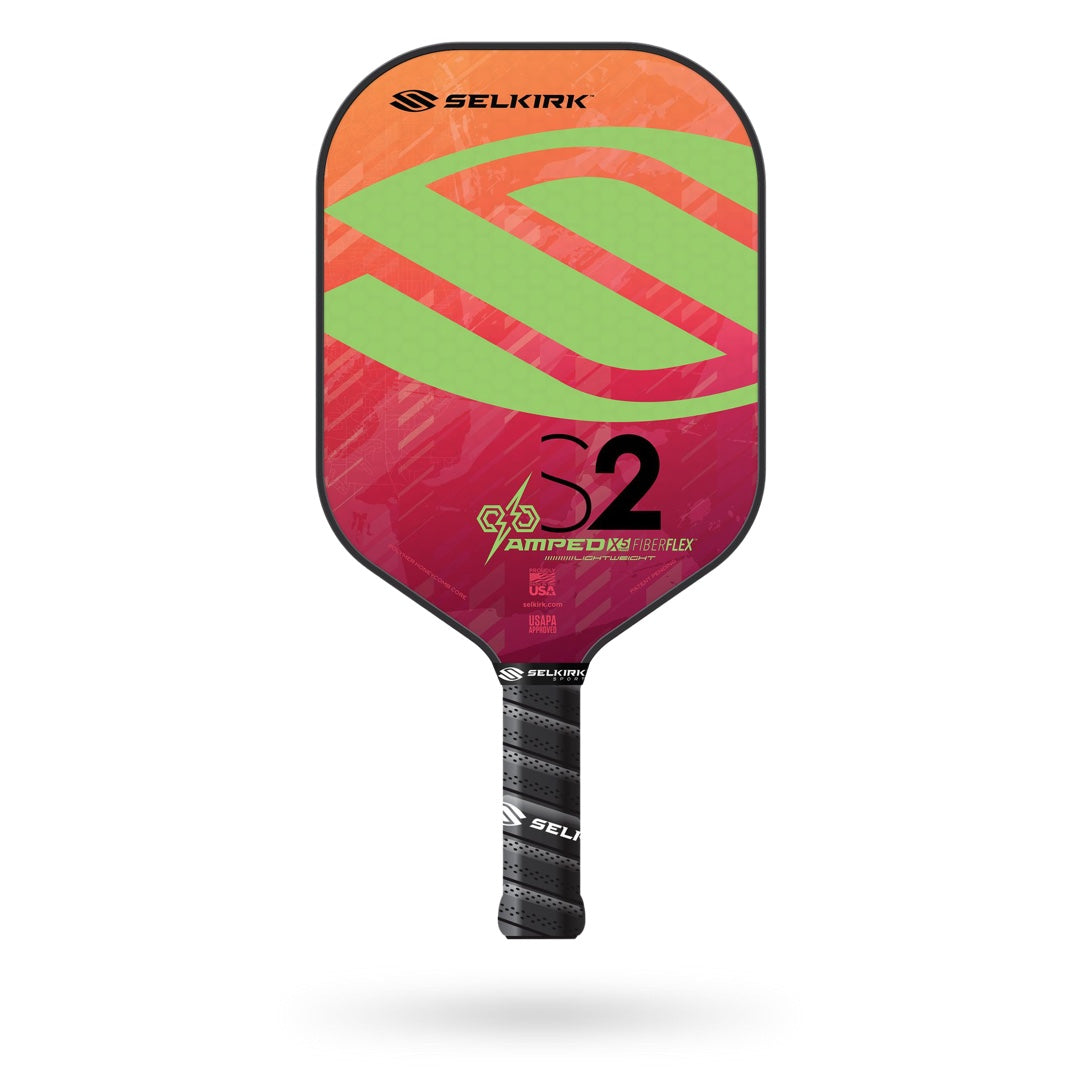 A Selkirk Amped S2 Pickleball Paddle with an orange and red design on it.