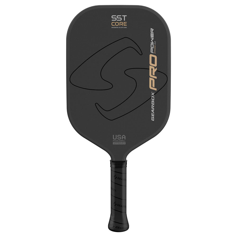 A black Gearbox Pro Power Integra Pickleball Paddle featuring a carbon fiber framework, SST core, and a textured grip from Gearbox.