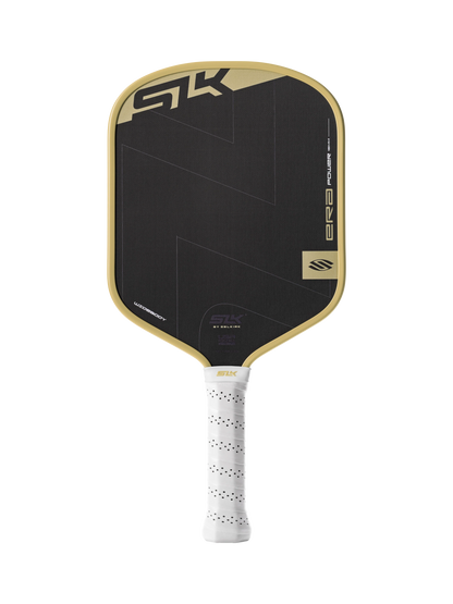 The Selkirk SLK ERA Power Widebody Carbon Fiber Pickleball Paddle features a black carbon fiber face with gold trim, a white perforated handle, “SK” branding at the top, and a power widebody design for superior performance.