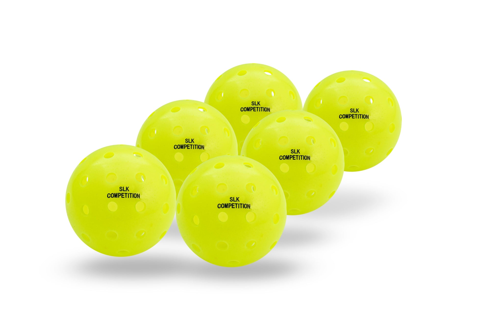 Seven yellow pickleball balls with "Selkirk SLK Competition" printed on them, arranged in a triangle formation on a white background.