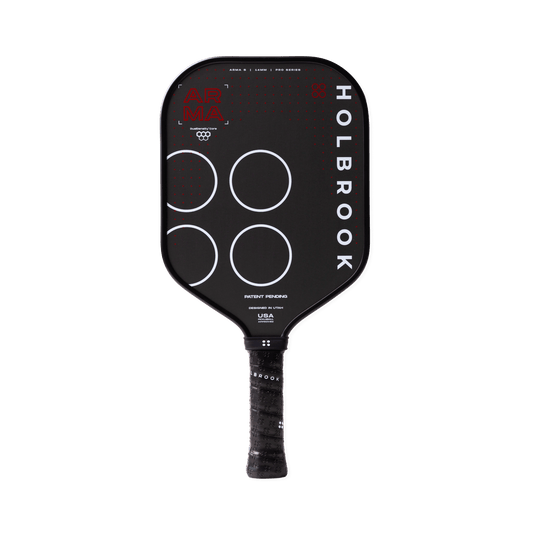 The Holbrook Arma S 14mm pickleball paddle features a sleek black design with white circle and text accents, a wrapped handle, distinctive Holbrook branding, and the advanced Dual-Density™ Core for enhanced play.