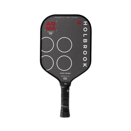 The Holbrook Arma S Metallic 14mm pickleball paddle features a black design with white circles, red "APMA" text, a textured grip, and a Dual-Density™ Core, shown on a white background.