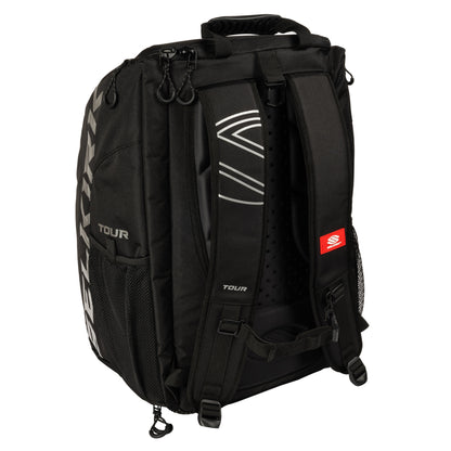 A Selkirk Core Series Tour Backpack Pickleball Bag with adjustable shoulder straps, mesh pockets, and branded designs. The bag has a top handle and several compartments, designed for carrying gear and essentials.