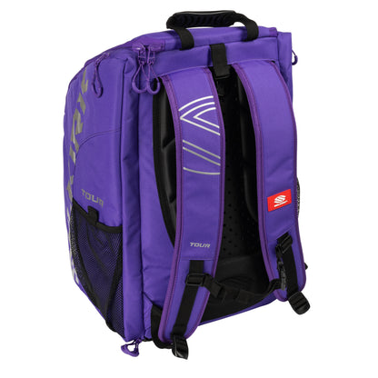 A purple and black Selkirk Core Series Tour Backpack Pickleball Bag with adjustable shoulder straps, mesh side pockets, and a top handle. The brand name "Selkirk" is visible on the side.