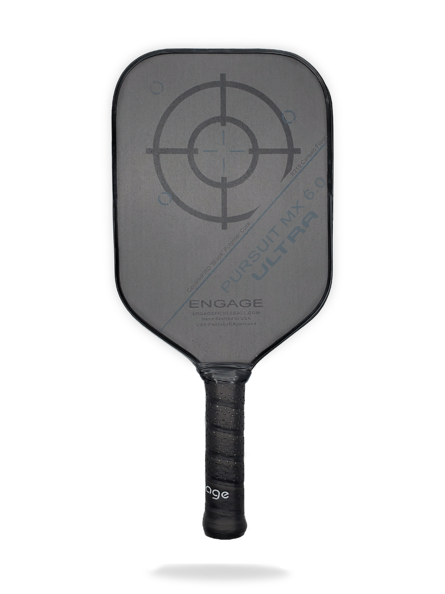 A black Engage Pursuit ULTRA MX 6.0 Pickleball Paddle with a large bullseye graphic on the face and the text "Pursuit MX 6.0 Ultra" and "Engage" printed on it. The handle is wrapped with a textured grip.