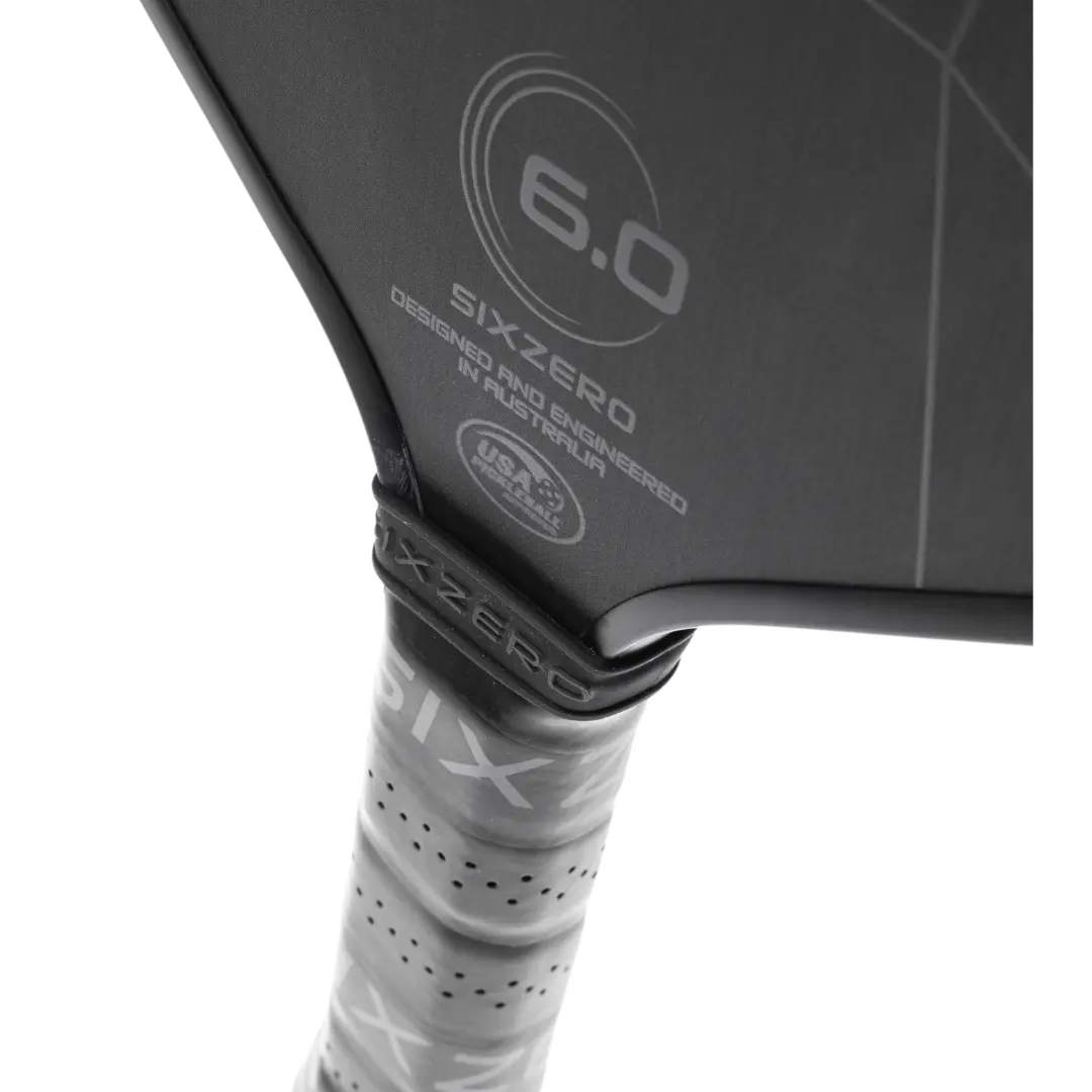 A black and white Six Zero tennis racket with a black handle.