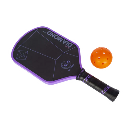 A Six Zero Black Diamond Power (16mm) Pickleball Paddle with an orange ball next to it.