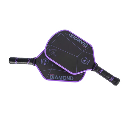 Two purple and black Pickleballist Six Zero Black Diamond Power (16mm) pickleball paddles arranged in an overlapping fashion on a white background.