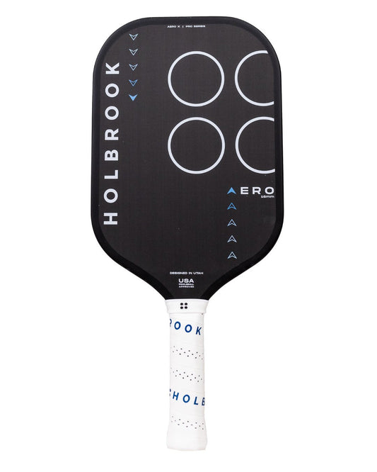 The Holbrook Pro - Aero X 16mm pickleball paddle features a black surface adorned with white circles, blue arrow designs, and the "Holbrook" text on the side. It has a white handle with perforations.